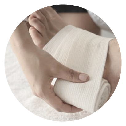 foot being wrapped with gauze